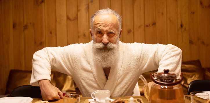 bearded-senior-man-drink-tea-after-procedure-sauna-concept-healthy-lifestyle-2