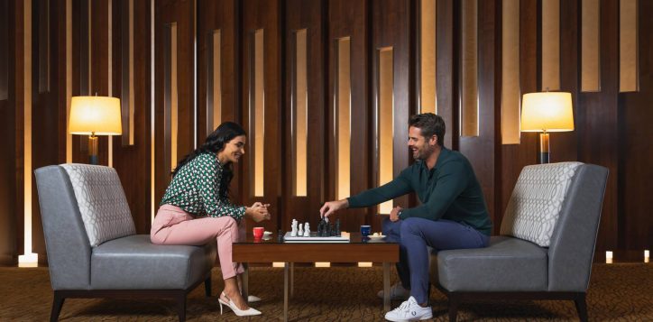 couple-playing-chess-in-yasmine-lounge-min