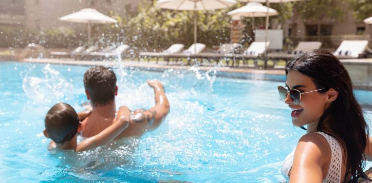 family-at-the-pool-min