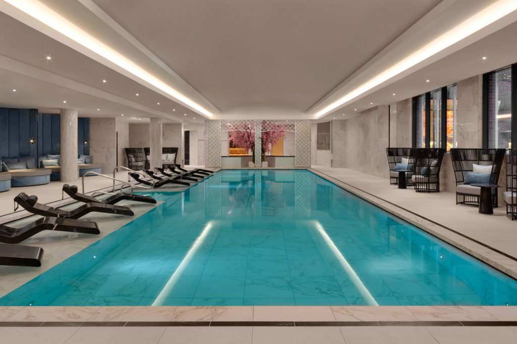 Luxury indoor swimming pool with loungers at Fairmont Spa and Wellness in Windsor,
