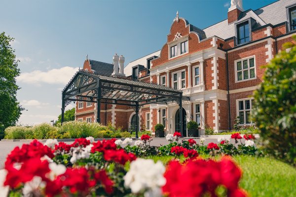 Fairmont Windsor Park luxury 5 star hotel in Windsor front entrance flowers, summer
