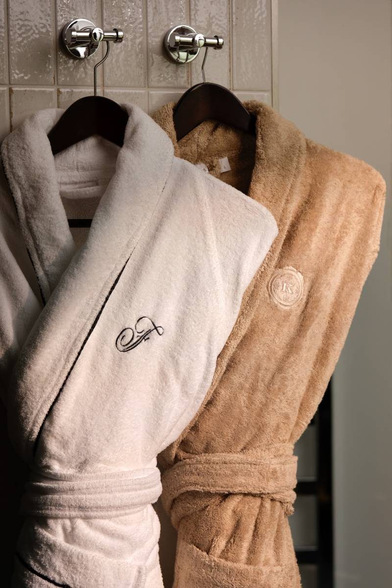 Treehouse Suite Two robes hanging in a suite bathroom