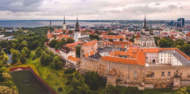 aerial-shot-old-town-tallinn-with-orange-roofs-churches-spires-narrow-streets
