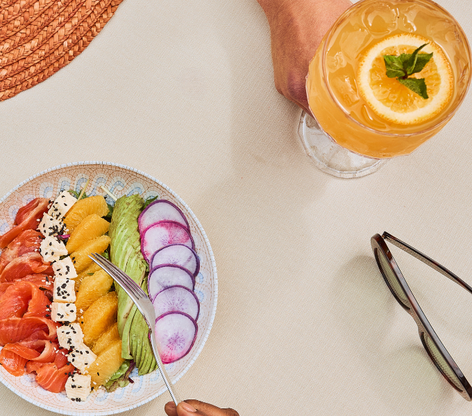 Healthy spa lunch with fresh avocado, citrus, radish and feta salad with refreshing drink served at Cape Grace wellness spa.