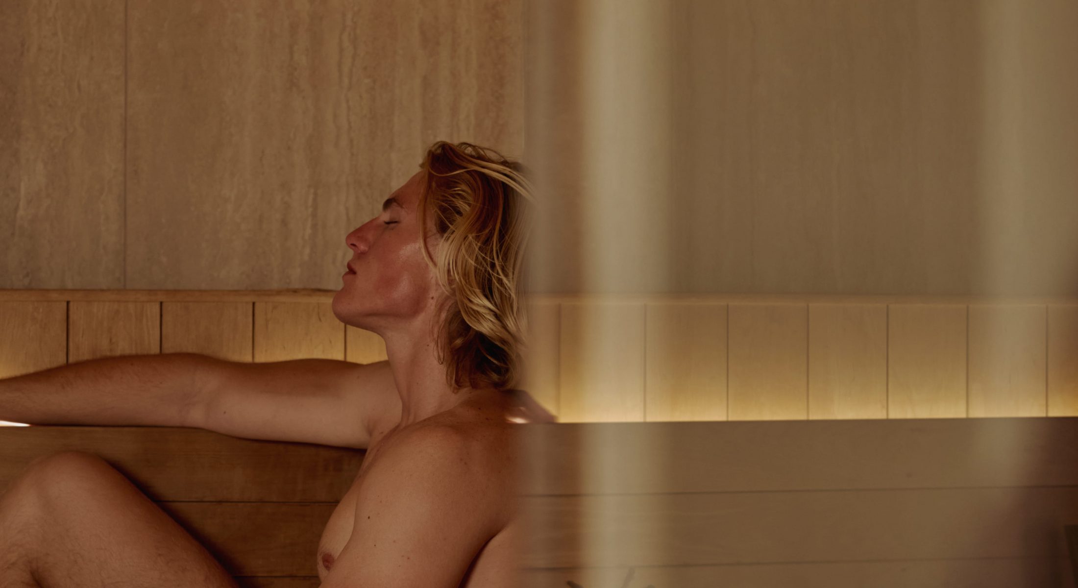 Guests relaxing in a tranquil wooden sauna at Cape Grace’s Fairmont Spa, enjoying a calm, wellness-focused spa experience.