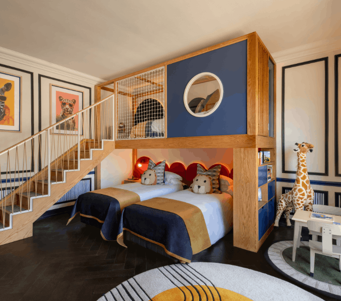 Stylish family suite bedroom at Cape Grace with elevated bunk area, twin beds, and thoughtful kid-friendly design elements.