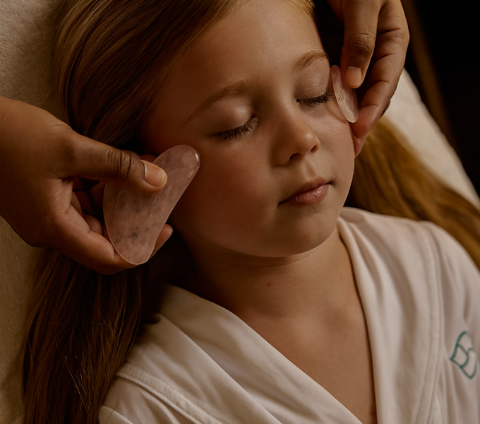 Child relaxing during a gentle spa treatment at Cape Grace, enjoying a calming wellness experience.