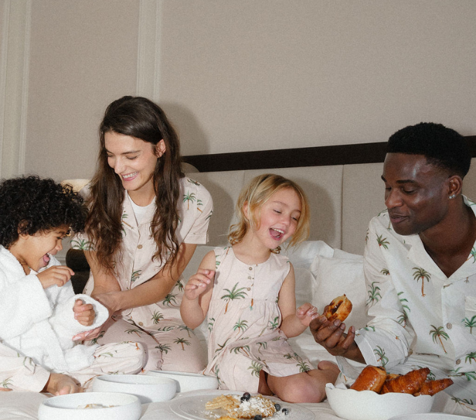 Family enjoying a relaxed in-room breakfast together at Cape Grace, sharing a joyful and comfortable moment.