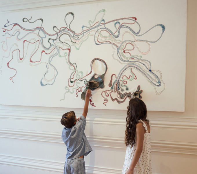 Children exploring artwork at Cape Grace, engaging with a playful and creative family friendly space.