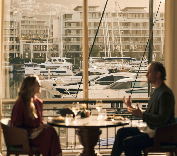 Guests dining beside the marina at Cape Grace on Cape Town’s V&A Waterfront.