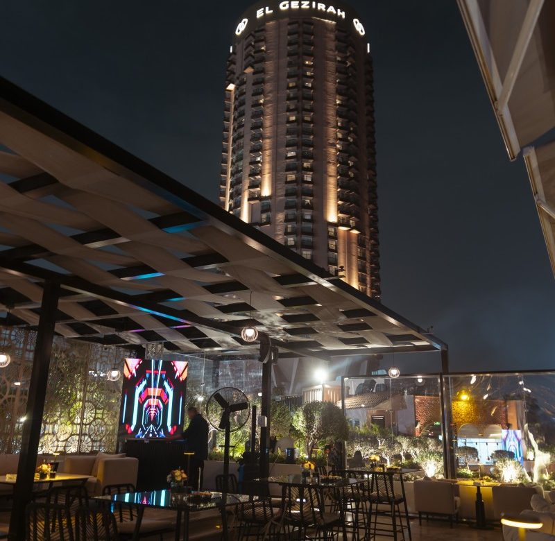 The Roof Top Cairo illuminated rooftop lounge with city skyline views