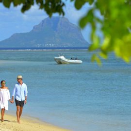 gallery Couple walking at the beach