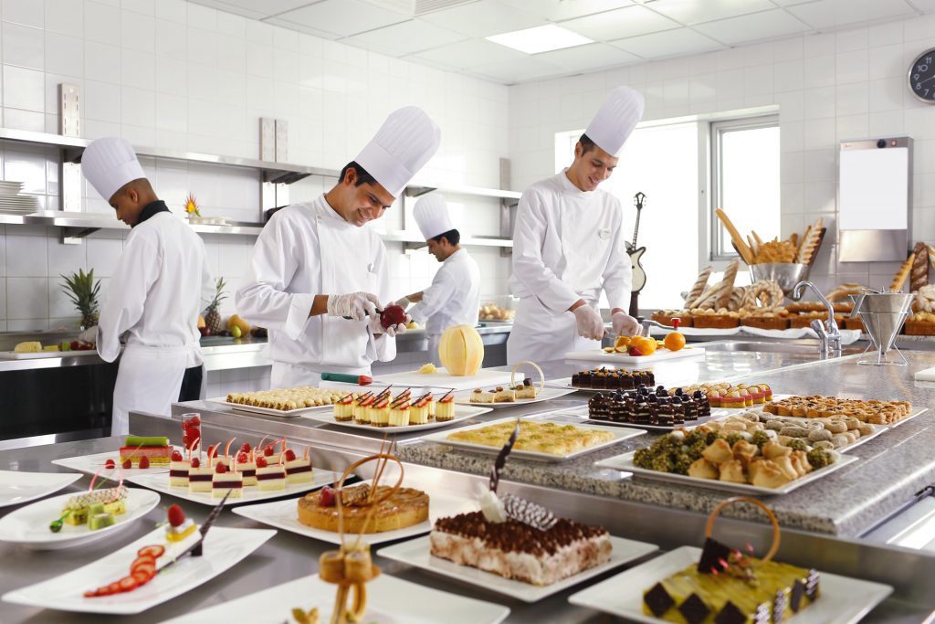Chefs preparing food in the Swissotel Makkah hotel restaurant