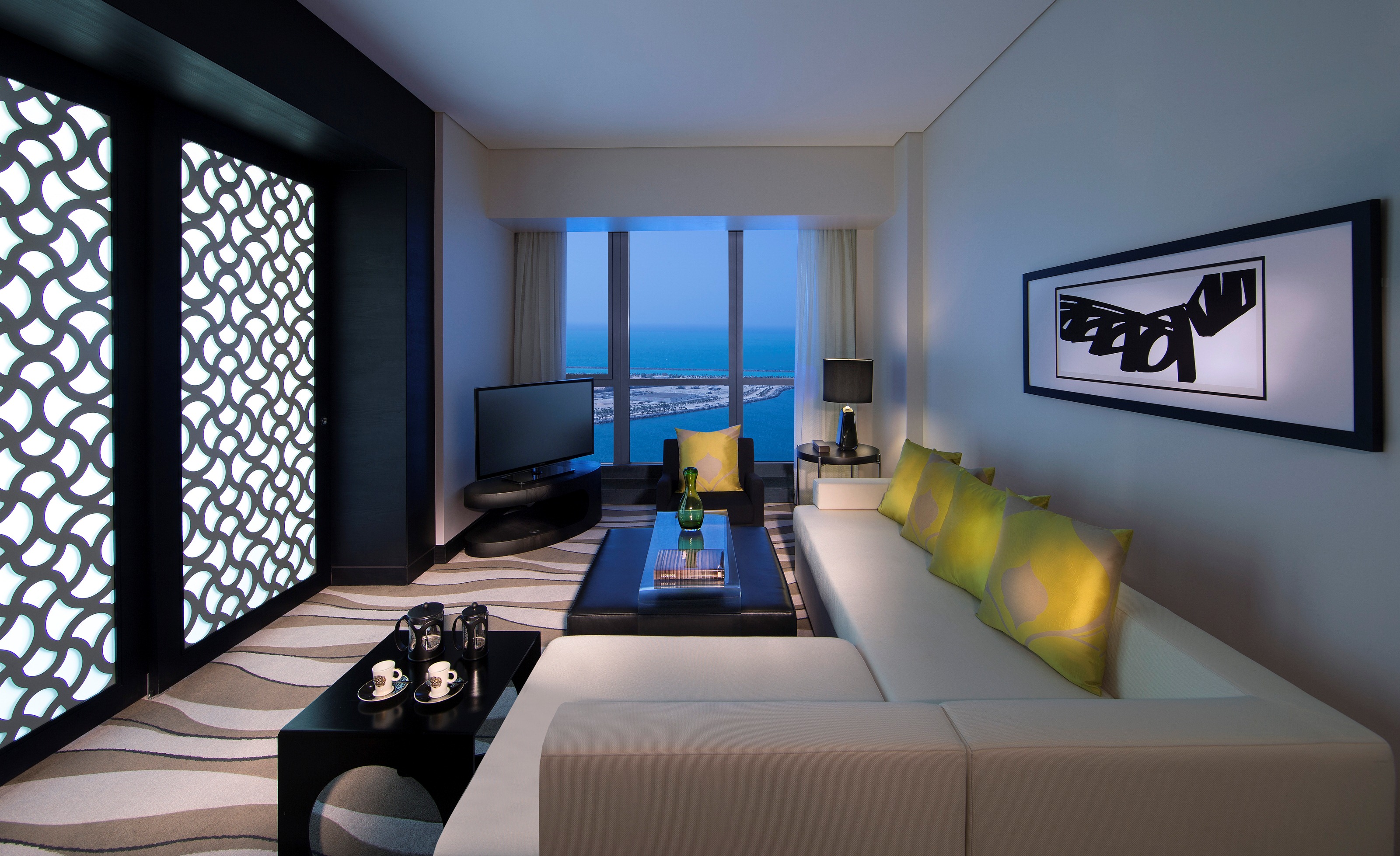 prestige-suite-club-millesime-access-1-king-bed-separate-living-room-sea-and-city-view